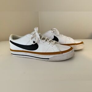 Nike White and Black Sneakers with Gold Trim